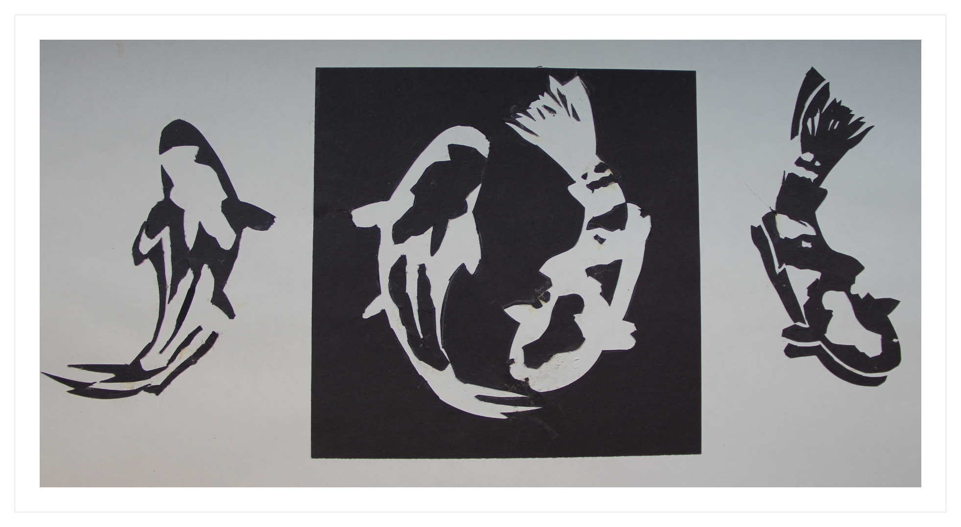 Paper cutout silhouette studies of koi fish